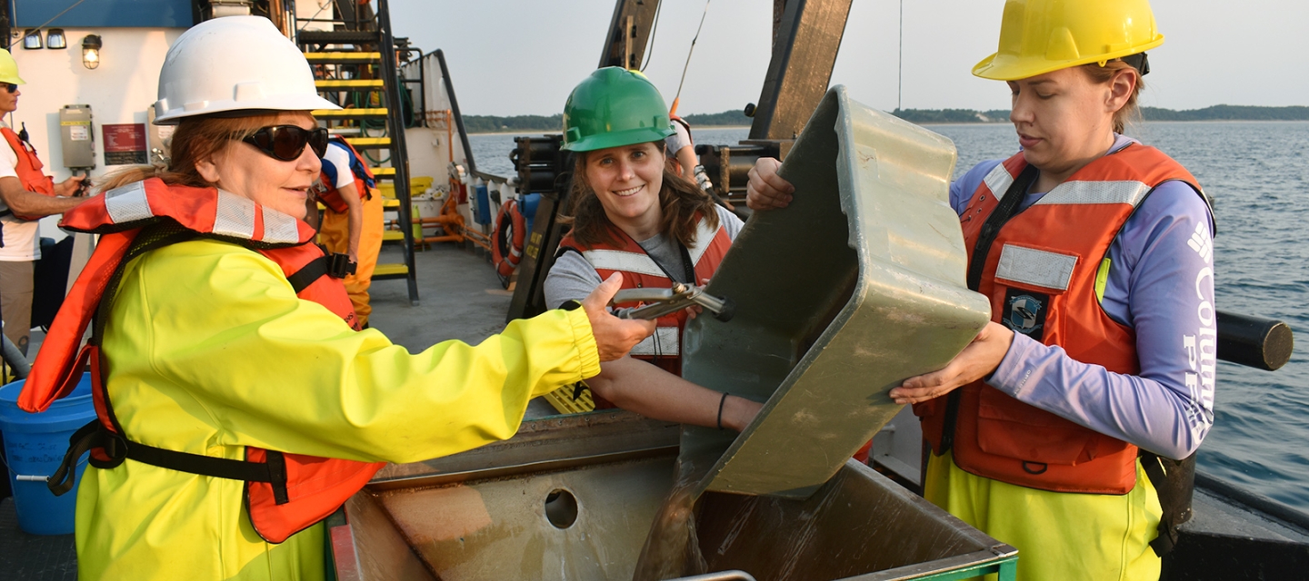 Student and faculty on boat